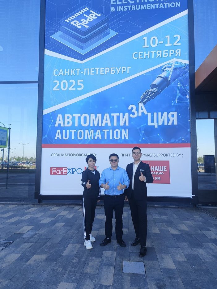 Hongrong staff in front of the organiser's board for the Automation exhibition, Saint Petersburg