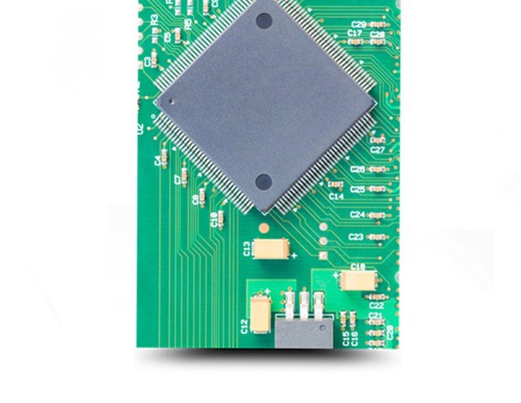 A board built around a large flat metal can, with fine-pitch parts around its perimeter