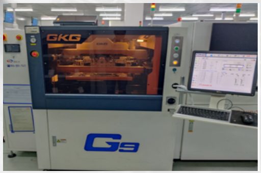 A GKG G5 solder paste printer on the SMT line, with the print programme open on the machine's monitor